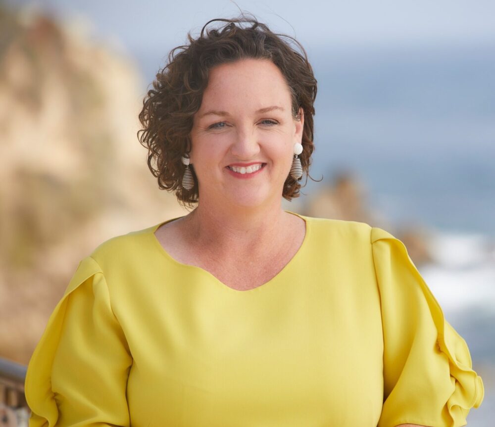 Katie Porter in a yellow dress